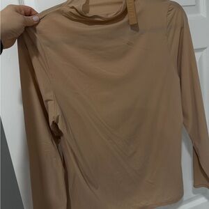 SKIMS fits everyone turtleneck